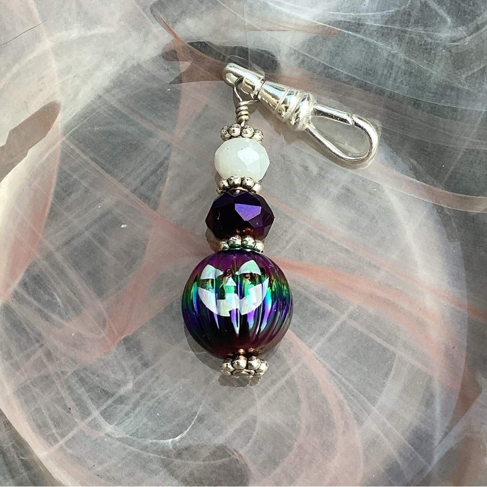Jack o lantern zipper pull in purple